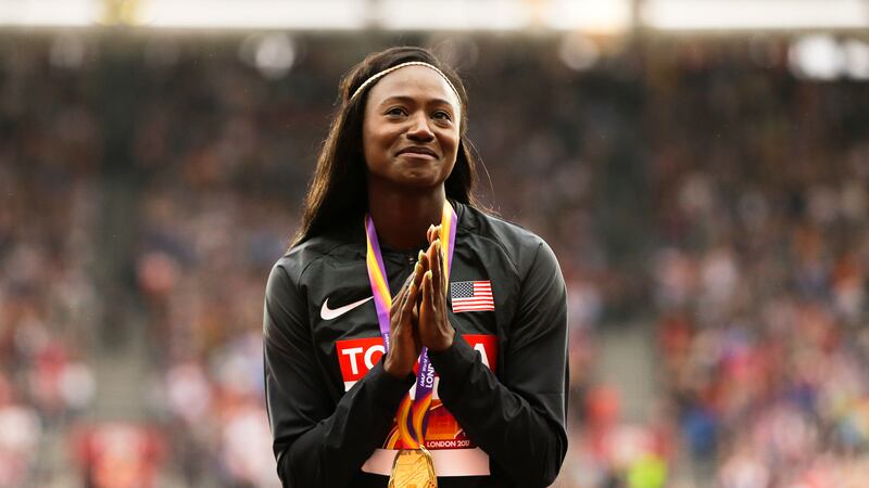 FILE - United States' Tori Bowie gestures after receiving the gold medal she won in the...