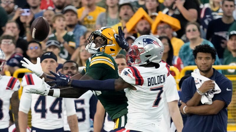 Green Bay Packers wide receiver Romeo Doubs (87) catches a pass against New England Patriots...