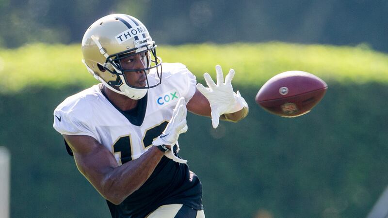 New Orleans Saints wide receiver Michael Thomas (13) catches the ball during an NFL football...