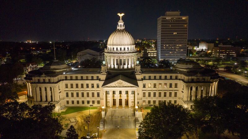 The Mississippi State Capitol is illuminated in Jackson, Miss., Thursday, Sept. 1, 2022. (AP...