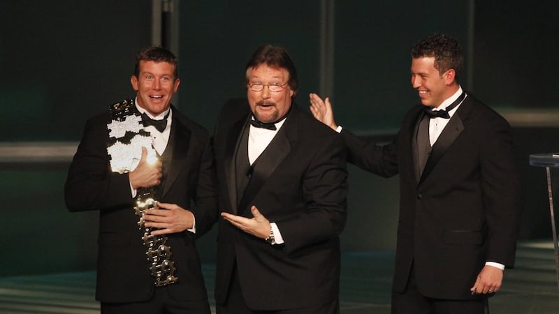 In this March 27, 2010, file photo, WWE Superstar Ted DiBiase Jr., left, with brother Brett...
