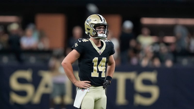 New Orleans Saints quarterback Jake Haener (14) reacts after throwing an interception into the...