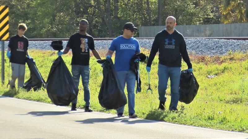 Together, volunteers cleared trash in and around East Railroad Street, amounting to about 10...
