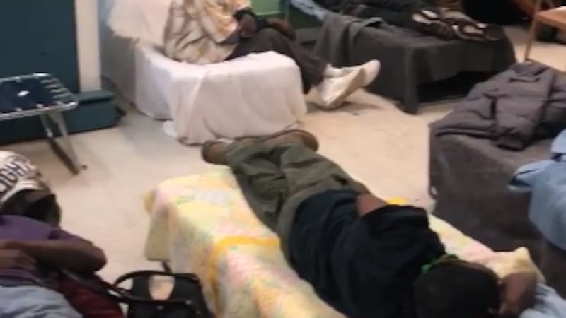 Man sings to crowd at cold weather shelter; Source: Stewpot Opportunity Center