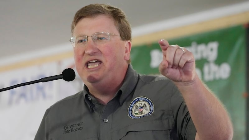 FILE - Mississippi Republican Gov. Tate Reeves addresses the crowd at the Neshoba County Fair...