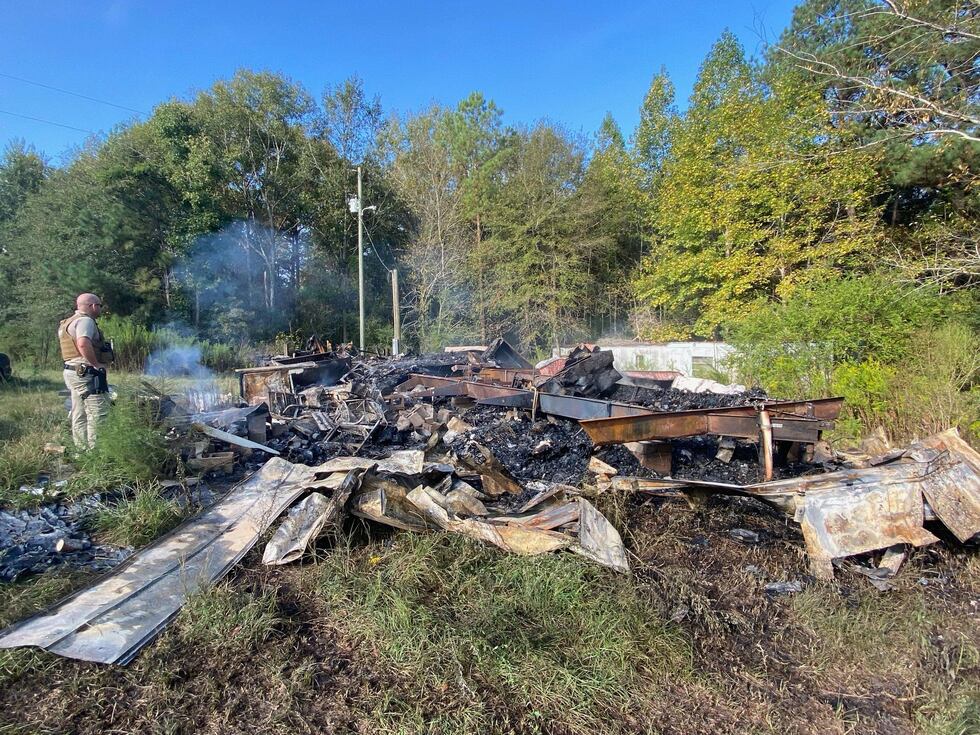 The Jones County Sheriff's Office surveys the destroyed mobile home where Sandra Buckingham...