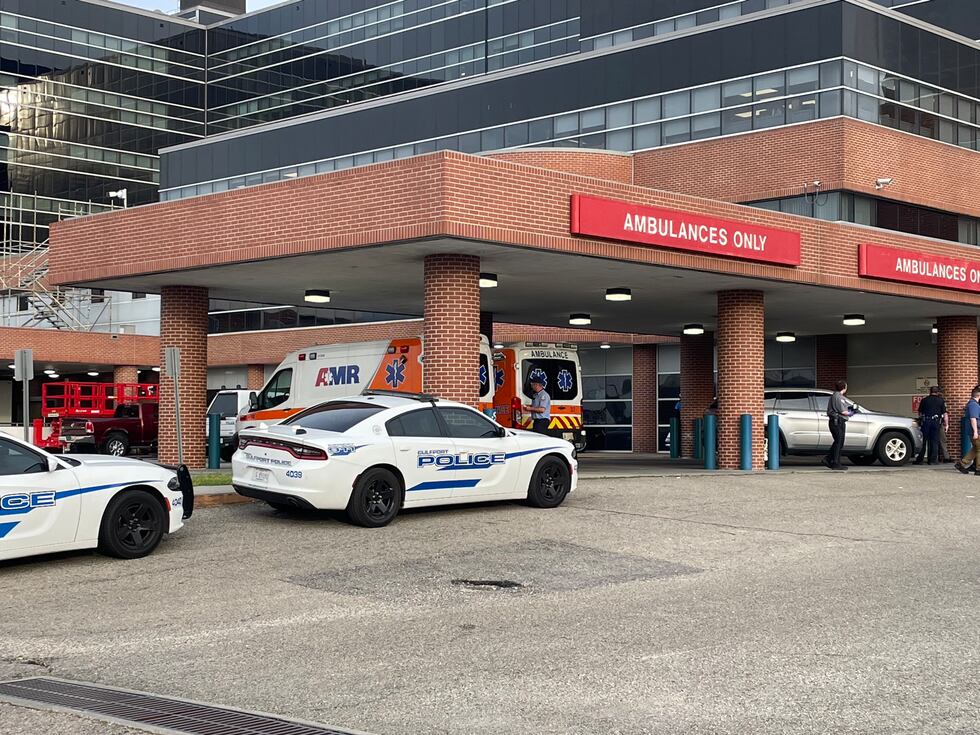 Law enforcement vehicles in front of Memorial Hospital