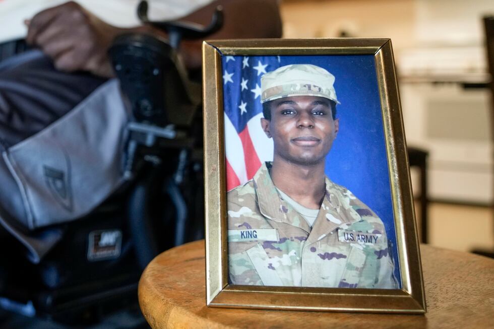 FILE - A portrait of American soldier Travis King is displayed as his grandfather, Carl Gates,...