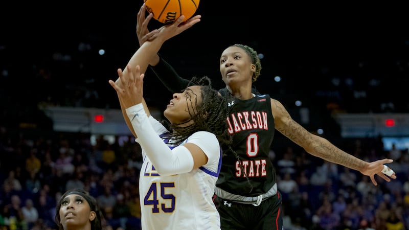 Jackson State forward Daja Woodard (0) blocks the shot of LSU guard Alexis Morris (45) in the...