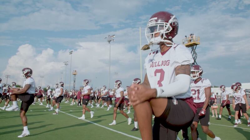 Mississippi State Bulldogs stretch during fall camp.