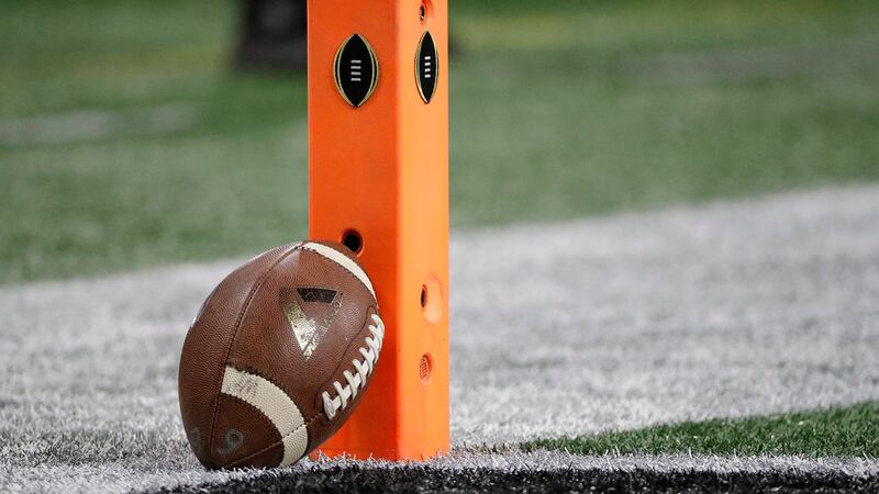 A football rests on a pylon before the NCAA college football playoff championship game between...