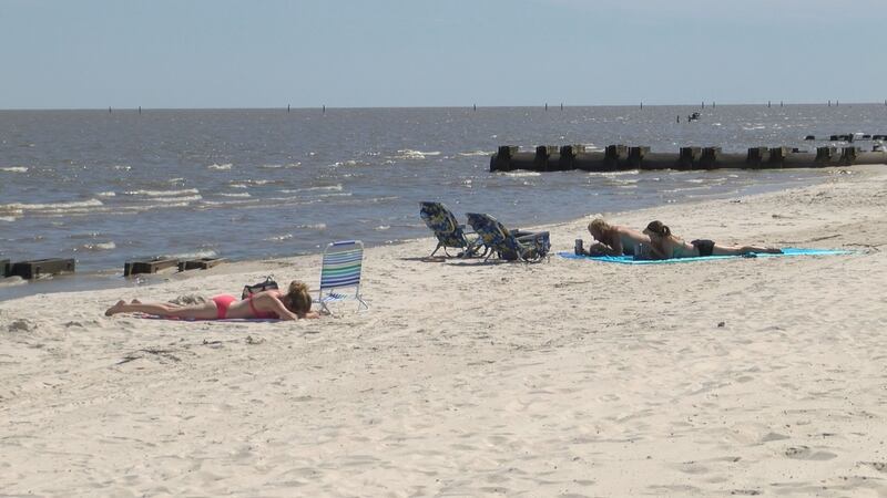 Beachgoers enjoy time on the recently re-opened Harrison County beaches