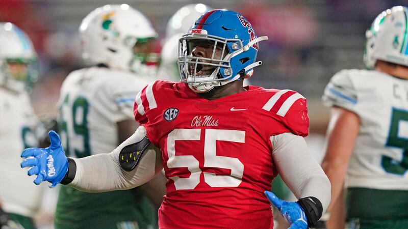 Mississippi defensive lineman KD Hill (55) celebrates his sacking Tulane quarterback Michael...