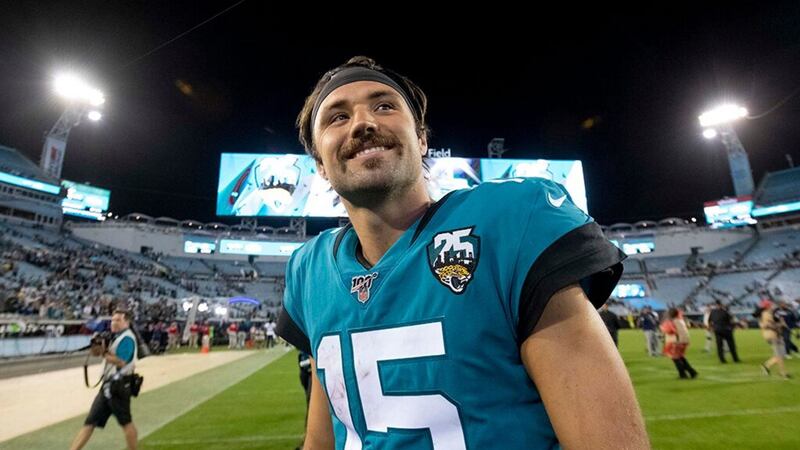 Jacksonville Jaguars quarterback Gardner Minshew (15) walks off the field after defeating the...