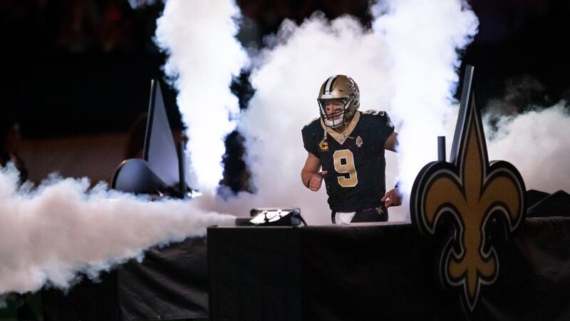 Drew Brees makes his dramatic entrance during a 2019 Saints home game