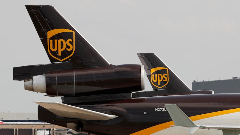 FILE - In this June 24, 2019, photo a UPS aircraft taxis to its hangar area after it arrived...
